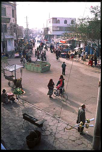 From a tea house :: Watching the world go by<br><br>Kashgar :: Xinjiang, China: Kashgar, Xinjiang, People's Republic of China
: City Scenes; Crowds.