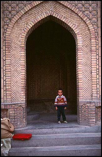 Boy in the Doorway<br><br>Kashgar :: Xinjiang, China: Kashgar, Xinjiang, People's Republic of China
: People You Meet.