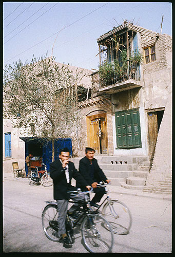I love to ride my bicycle<br><br>Kashgar :: Xinjiang, China: Kashgar, Xinjiang, People's Republic of China
: City Scenes; Buildings.