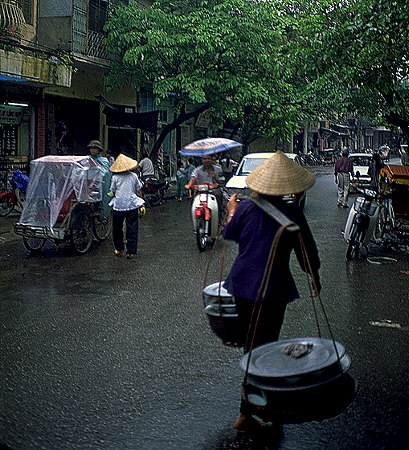 Rain quiets the busy streets<br>Hanoi, Vietnam: Hanoi, Vietnam
: City Scenes; People You Meet.
